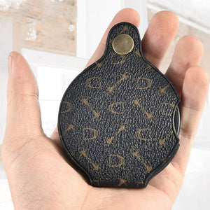 Taskukokoinen suurennuslasi nahkakotelolla